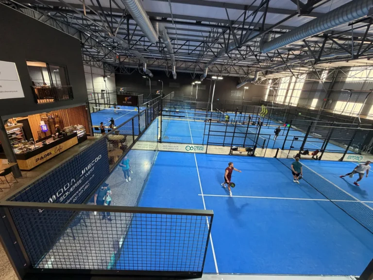 View over the blue indoor courts from the mezzanine at PadelX Somerset West