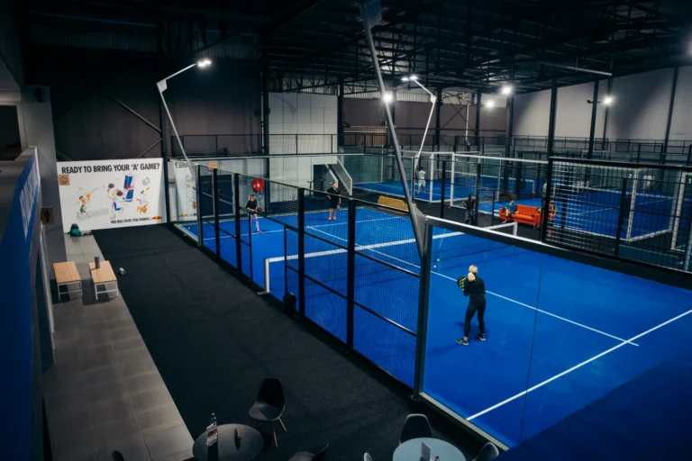 A match on one of the indoor courts at Aura Padel Club