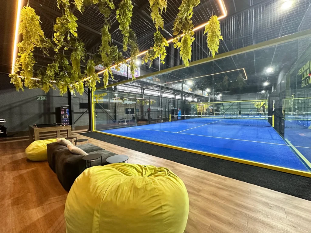 Indoor padel courts and beanbag lounge at The Racket + Ball Club on Bree Street