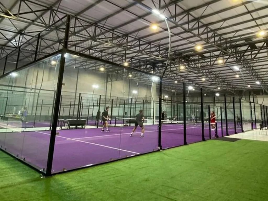 Players on a purple indoor padel court at Eden Padel, Durbanville Hills
